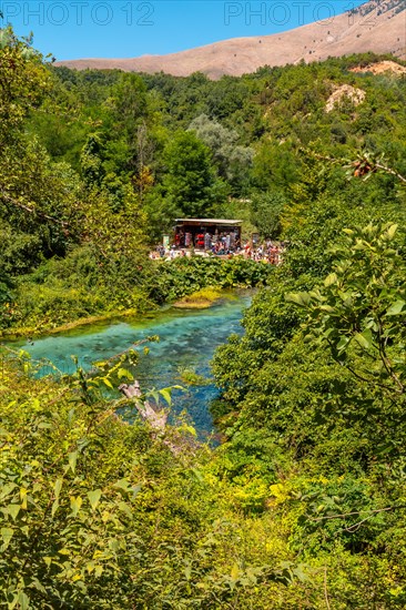 Tourists visiting The Blue eye or Syri i kalter