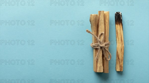 Wooden aromatic sticks tied with rope copy space