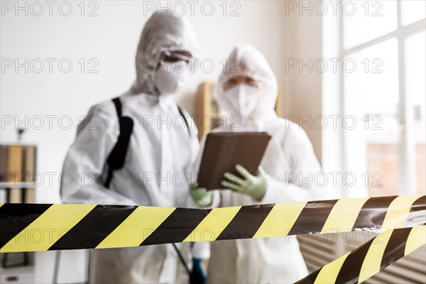 People protective suits talking