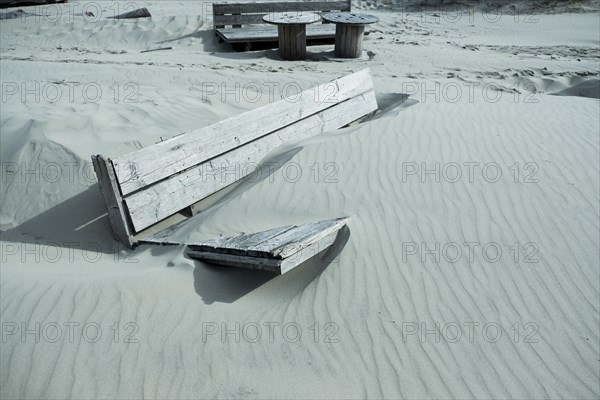 Shipped wooden furniture on the beach of West on the North Sea island of Terschelling