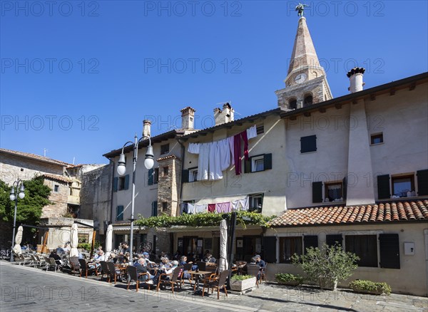 Restaurant in the old town with the Basilica of Sant Eufemia