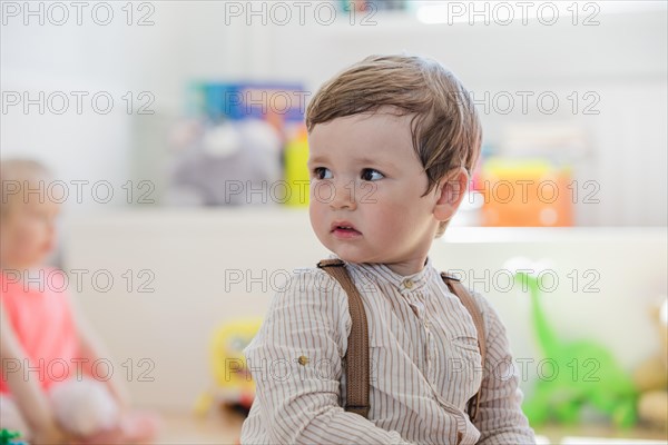 Boy striped shirt looking away