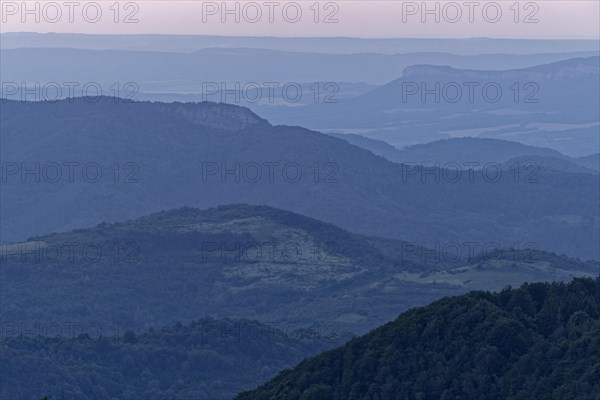 Evening mood over the mountain landscape of the Balkan Mountains and the forested slopes of the Balgarka nature park Park in Central Bulgaria. Shipka