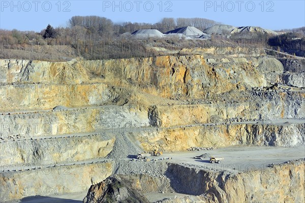 Trucks at work in porphyry quarry