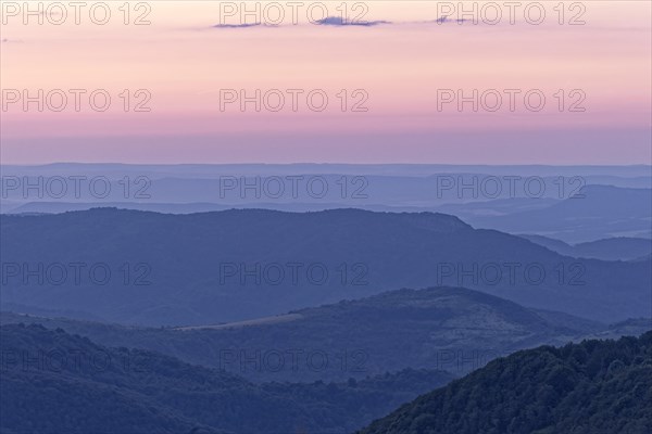 Evening mood over the mountain landscape of the Balkan Mountains and the forested slopes of the Balgarka nature park Park in Central Bulgaria. Shipka