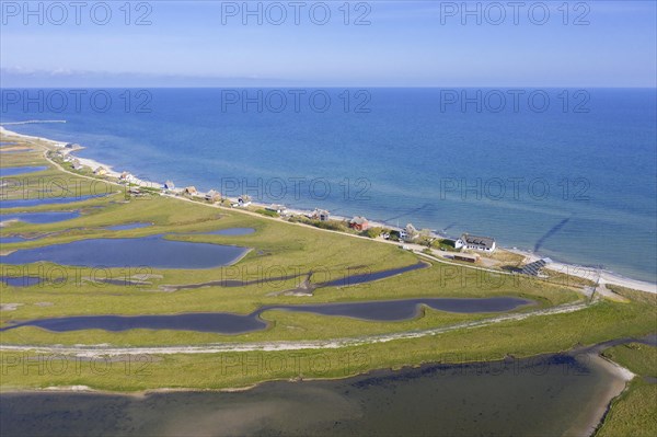 Aerial view over houses on the shore along the Baltic Sea coast at Steinwarder peninsula