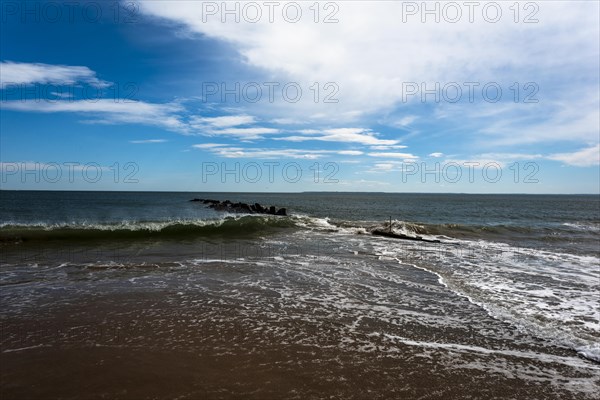 Listening to the ocean waves on a sunny spring day on the Brighton Beach