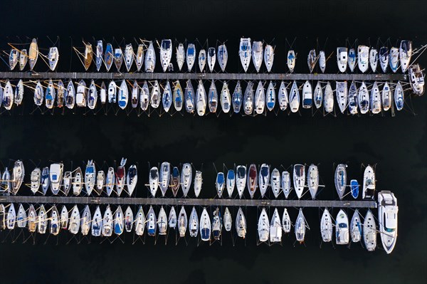 Aerial view over jetties with sailing boats at marina in harbour of Heiligenhafen along the Baltic Sea