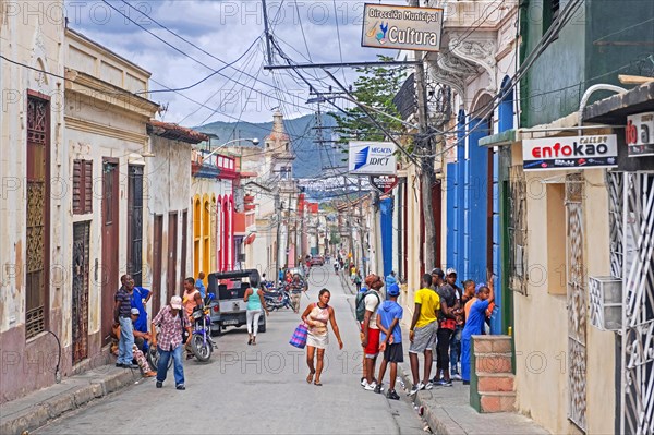 Street scene showing Afro-Cubans and shops in Santiago de Cuba
