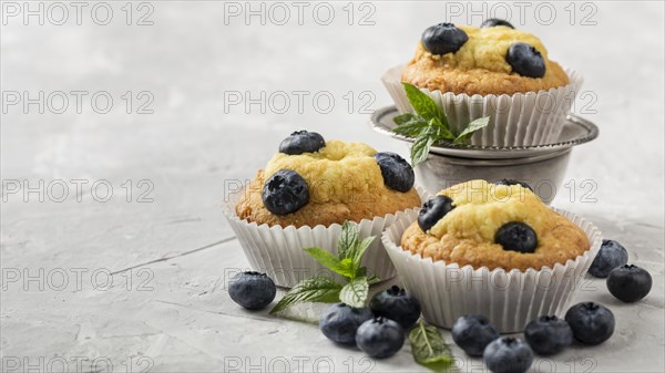 High view tasty cupcake with blueberry forest fruit