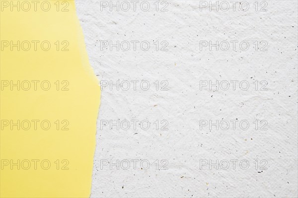 Yellow paper white old textured background