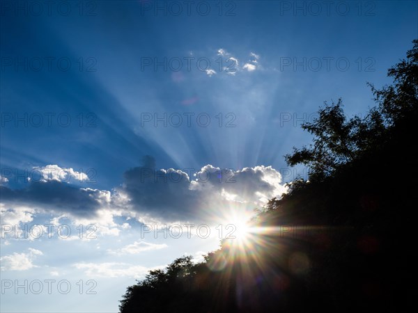 Rays of sunshine breaking through clouds