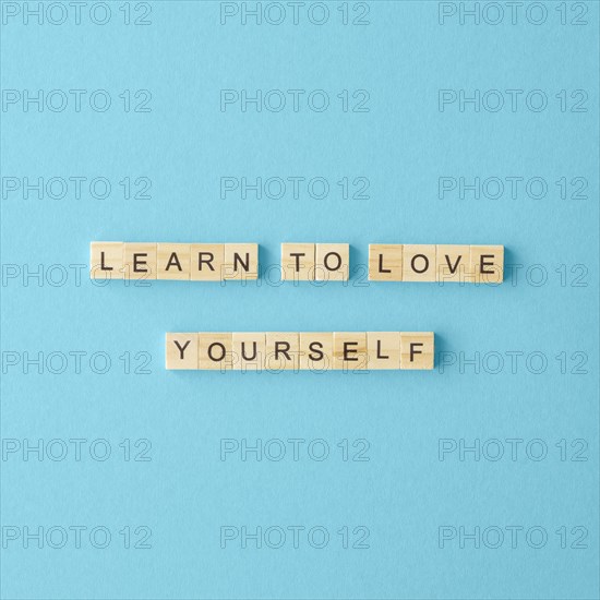 Top view letter cubes blue background