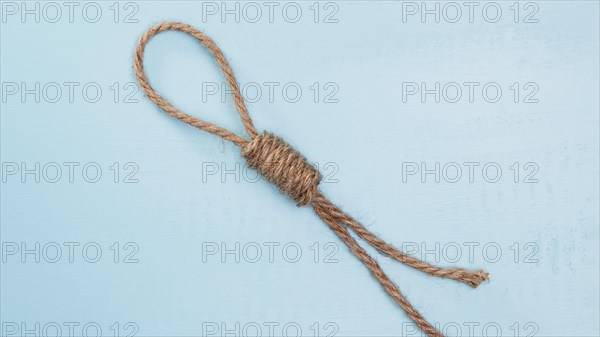 Brown solid rope with difficult knot