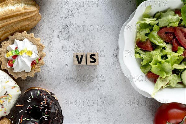 High angle view healthy vs unhealthy food concrete background