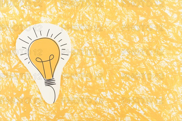 Hand drawn light bulb cut out yellow pattern background