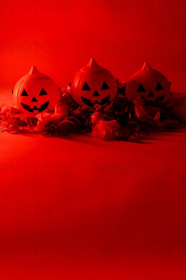 Halloween pumpkins on a red background