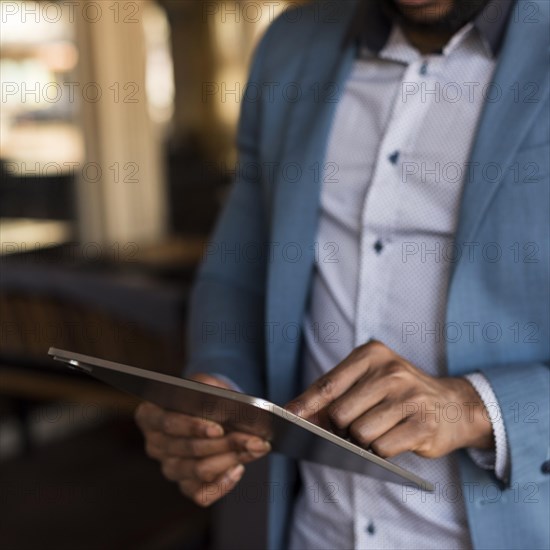 Modern man looking his tablet