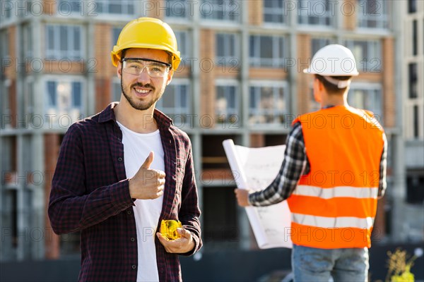 Medium shot portrait smiling architect looking camera