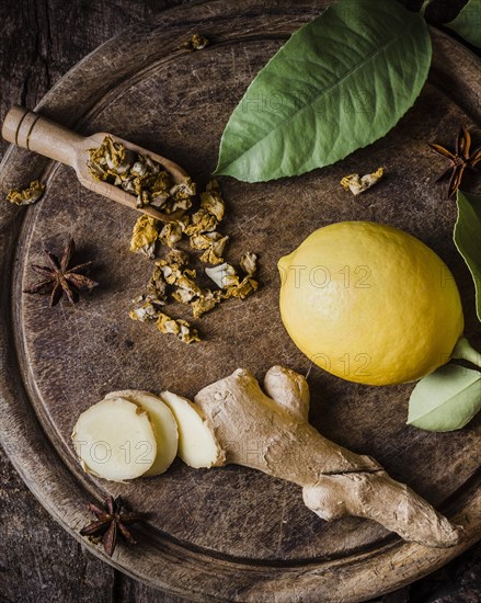 Top view lemon ginger slices cutting board