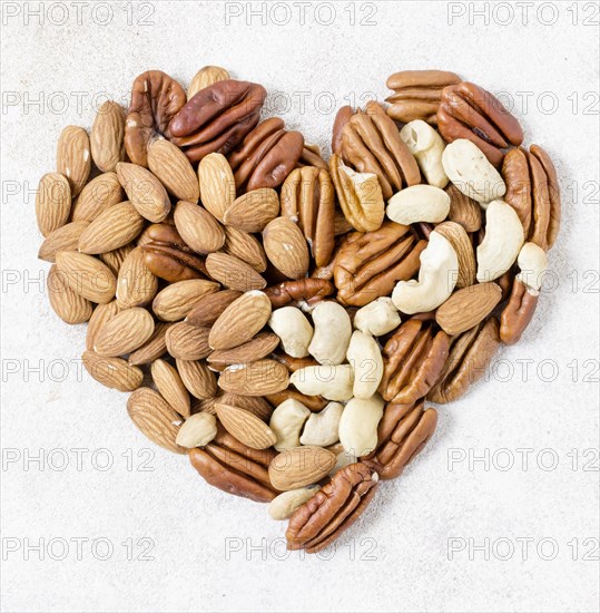 Top view heart made walnuts almonds