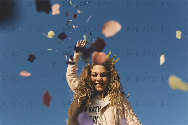 Girl throwing confetti