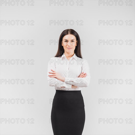 Business woman standing with crossed arms