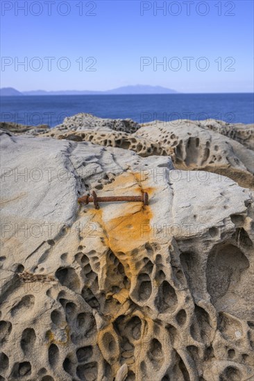Rusty screw and stone structures in the Buca delle Fate