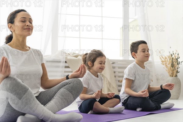 Medium shot people yoga mat
