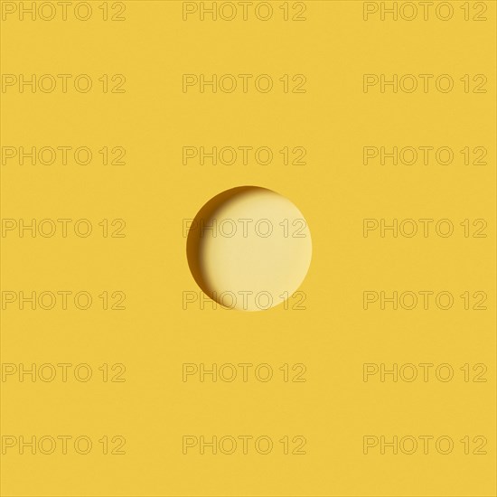 Modern background with light yellow circular piece paper