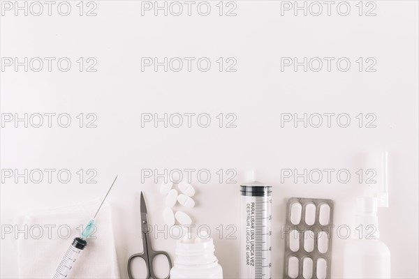 Elevated view pills medical equipments white background