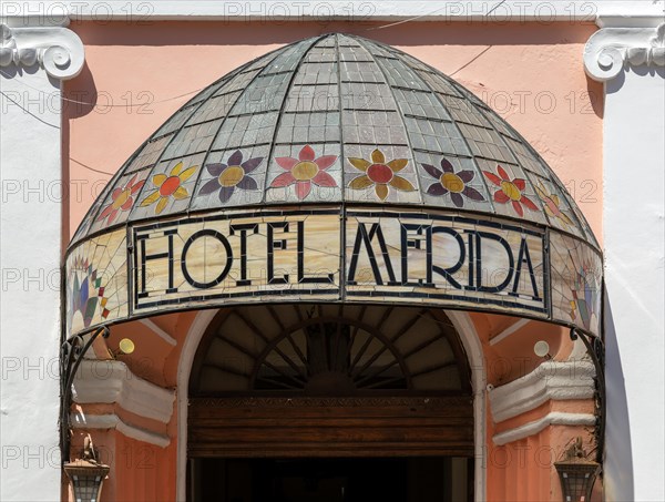 Stained glass canopy entrance to colonial style Hotel Merida