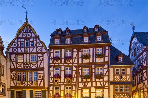 Gabled half-timbered houses on the medieval market square in the evening
