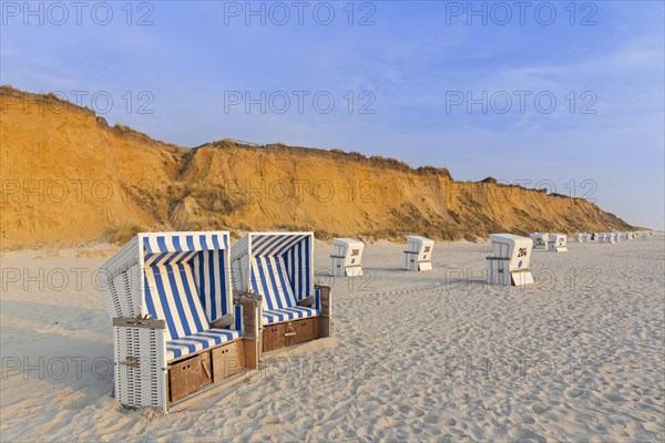 Roofed wicker beach chairs at the Rotes Kliff