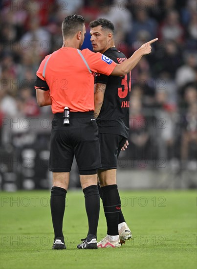 Referee Daniel Schlager in conversation Discussion with Granit Xhaka Bayer 04 Leverkusen