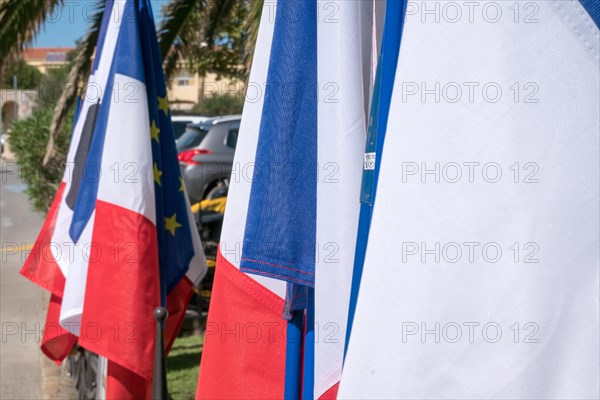 Flags at the monument to the Corsicans who died during the First World War in the port town of Calivi in the west of the Mediterranean island of Corsica