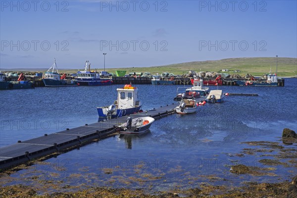 Fish farming workboats in the harbour of Uyeasound on the Isle of Unst