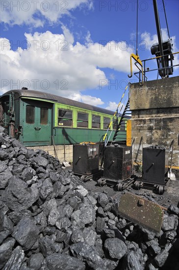 Crane and heap of coal as fuel for steam train at the depot of the Chemin de Fer a Vapeur des Trois Vallees at Mariembourg