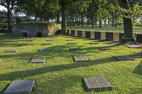 Bunker and graves of fallen German soldiers at the First World War One military cemetery Deutscher Soldatenfriedhof Langemark