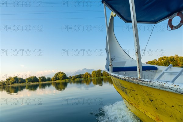 Sailing around the lake in a traditional boat on a sightseeing excursion from Shkoder in Shiroka. Albania