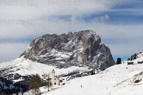 Snow-covered mountains and chapel