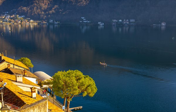Cityscape and Lake Lugano with Blue Sky and Mountain in a Sunny Day in Morcote