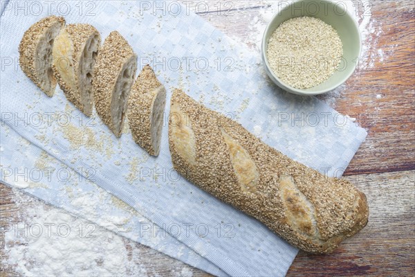 Freshly baked vegan baguette with sesame seeds