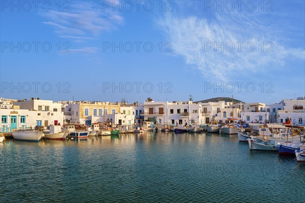 Traditional Greek fishing village and harbour on sunny day