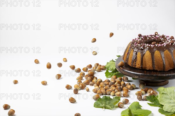 Vegan hazelnut cake on wooden serving plate