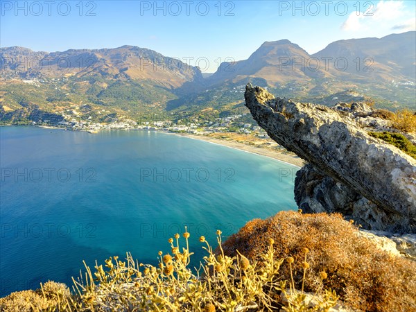 View over a cliff onto the bay and beach of Plakias