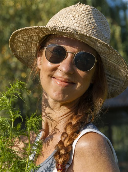 Woman in herb bed
