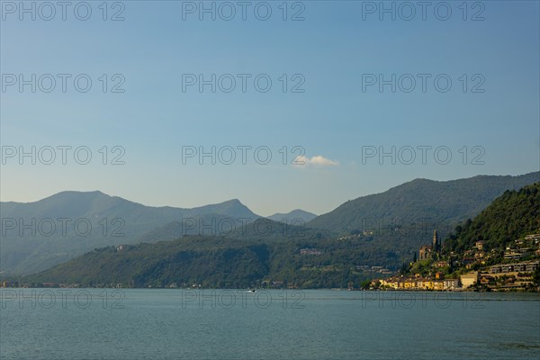 Lake and Mountain View over Morcote in a Sunny Summer Day on Lake Lugano in Morcote
