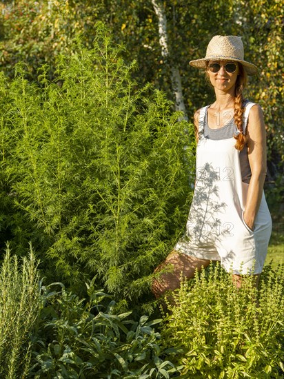 Woman in herb bed