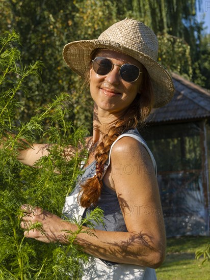 Woman in herb bed